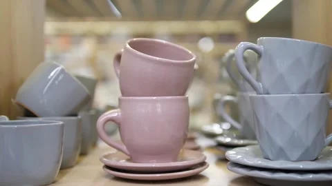 New pink and blue kitchenware on the shelf. New beautiful tea ceremony tableware Stock Footage 313122301