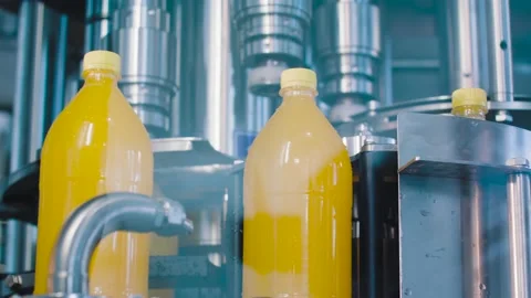 The new plastic bottles on the conveyor belt at the juice factory Stock Footage 131843675