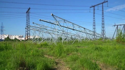 New poles for power lines lying on the ground. For the next installation in the  Stock Footage 78660836