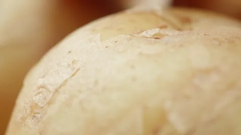 New potato close up rotating camera motion stock footage Stock Footage 337468991