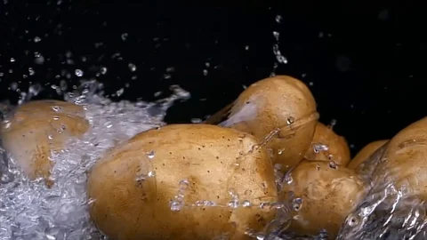 New potato isolated on black background Stock-Footage 121782659