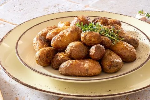 New potatoes in a dish on a table 스톡 사진