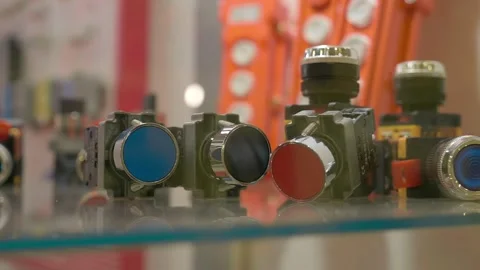 New powerful buttons in different colors for industrial equipment Stock Footage 333348880