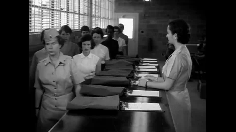 New recruits at the Women's Army Center are being given their uniforms in the Stock Footage