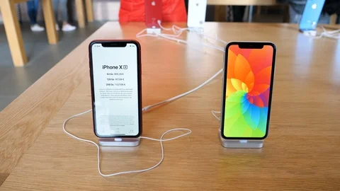 New Red and white iPhone Xr smartphone Stock Footage 97538937