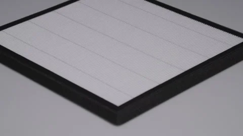 New Replacement HEPA Filter for an Air Purifier on a Grey Background Stock Footage 315946629