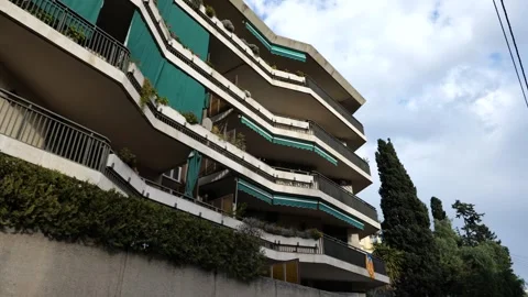 New residential building development next to aged apartment blocks in Barcelona Stock Footage 241018959