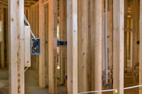 A new residential construction project involves framing and wiring a basic 스톡 사진