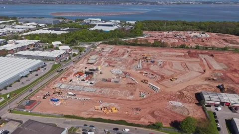 New residential development under construction beside industrial estate Stock Footage 334799836