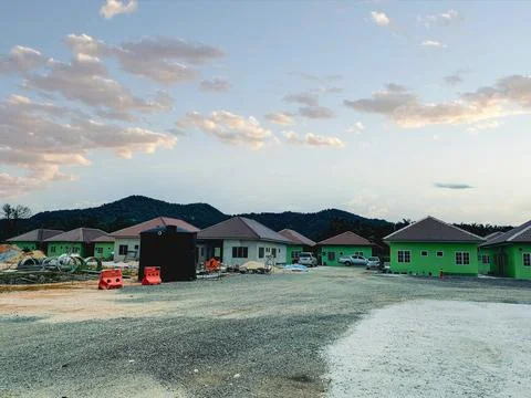 A new residential development is under construction in a mountainous area. Stock Photos