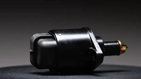 A new reverse gear sensor for a car's transmission. The new part rotates against Stock Footage 328911354