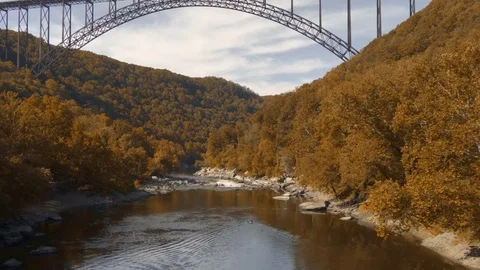 New River Gorge Bridge in Fall with Canoe Stock Footage 82164175