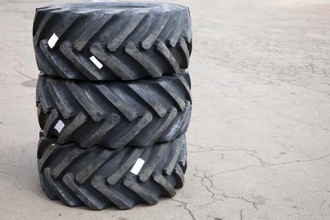 New rubber on the loader, rubber for the tractor. New rubber. Stock Photos