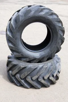 New rubber on the loader, rubber for the tractor. New rubber. Stock Photos