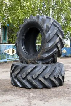 New rubber on the loader, rubber for the tractor. New rubber. Stock Photos