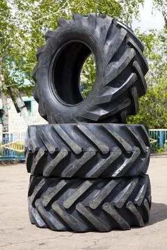 New rubber on the loader, rubber for the tractor. New rubber. Stock Photos