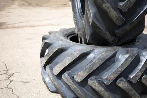 New rubber on the loader, rubber for the tractor. New rubber. Stock Photos