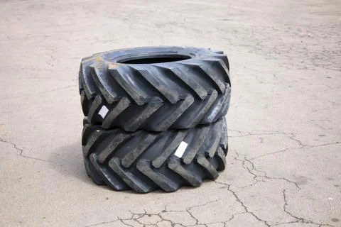New rubber on the loader, rubber for the tractor. New rubber. Stock Photos