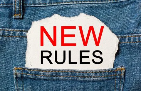 New rules on torn paper background on jeans business and finance concept Stock Photos