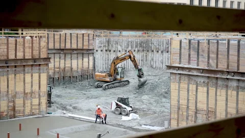 New school building construction with excavation pit foundation slab Stock Footage 338355887