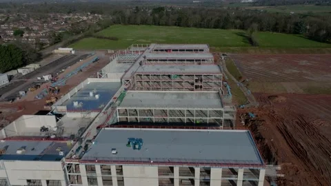 New School Construction Building Site UK Large Steel Frame Aerial View Fly Stock Footage 171576667