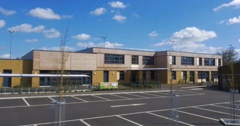 New school with solar panels and playground, England, UK Stock Footage 102411535