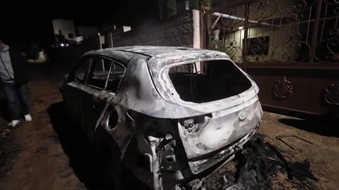 A new settler attack in the West Bank leaves at least ten Palestinians injured,  Video stock 331267258