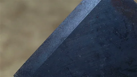 The new sharpened plane blade is extremely close-up. Oxidized gray metal Stock Footage 149219217
