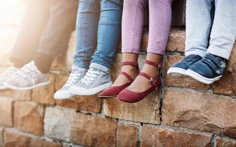 New shoes for the new school year. unrecognizable elementary school kids sitting Stock Photos