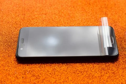 New smartphone with plastic screen protector 스톡 사진