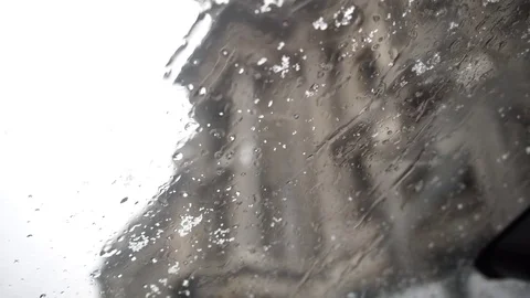 New Snow and Ice hitting the windshield at day Stock Footage 01 Stock Footage 84896444