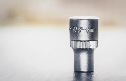 New socket wrench size 8 mm on blurred background Stock Photos