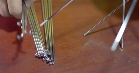 New spokes on motorcycle wheels.Shiny plated spokes add beauty to the wheels. Stock Footage 294700847