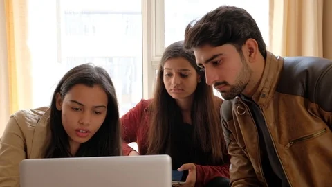 New start-up team working on a laptop and new technology on their computer and s Stock Footage 101362963