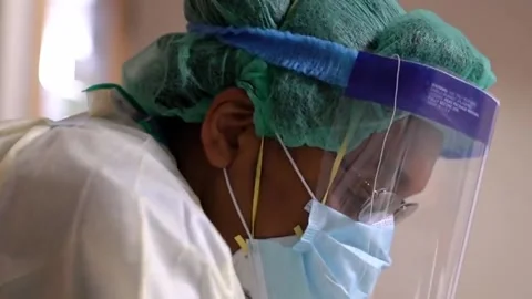 New strains of Delta and Lambda coronavirus. Medics in protective suits (30) Stock Footage 156869002