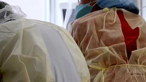 New strains of Delta and Lambda coronavirus. Medics in protective suits (24) Stock Footage 156869037