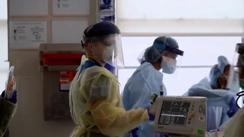 New strains of Delta and Lambda coronavirus. Medics in protective suits (23) Stock Footage 156869043