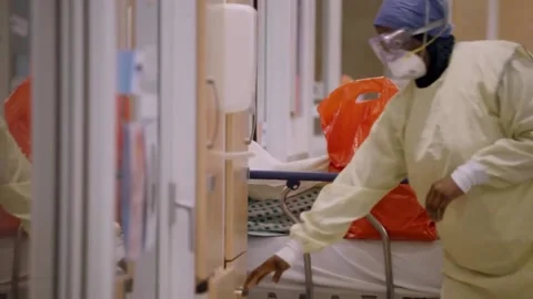 New strains of Delta and Lambda coronavirus. Medics in protective suits (19) Stock Footage 156869073