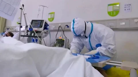 New strains of Delta and Lambda coronavirus. Medics in protective suits (5) Video stock 156869157