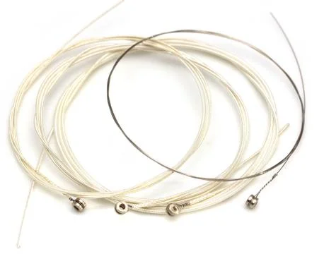 New string from a guitar on a white background. macro Stock Photos