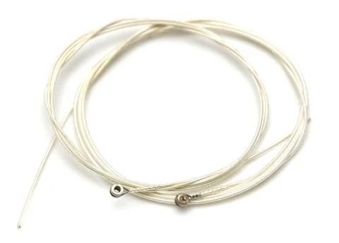 New string from a guitar on a white background. macro Stock Photos