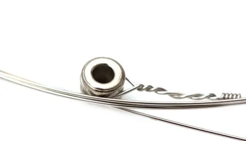 New string from a guitar on a white background. macro Stock Photos