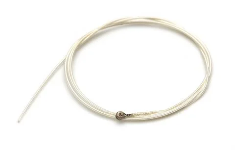 New string from a guitar on a white background. macro Stock Photos
