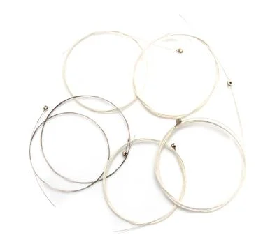 New string from a guitar on a white background. macro Stock Photos
