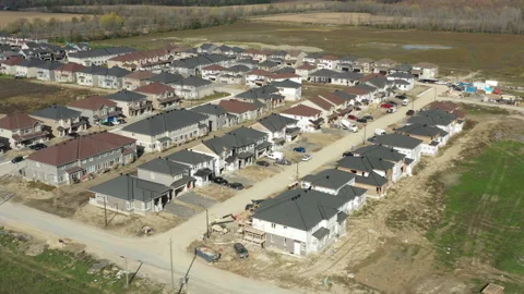 New subdivision of homes being built - construction housing market Stock Footage 168250048