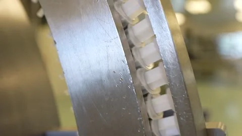 New syringes with needle on conveyor line. Video stock 256480323