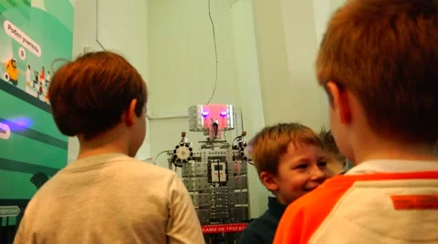 New technologies. Robot . AI.  Children playing with robots. Stock Footage 50225397
