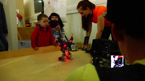 New technologies. Robot.  AI.  Children playing with robots. Stock Footage 50225600