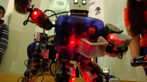 New technologies. Robot.  AI. Children watching the dancing robots. Stock Footage 50227485