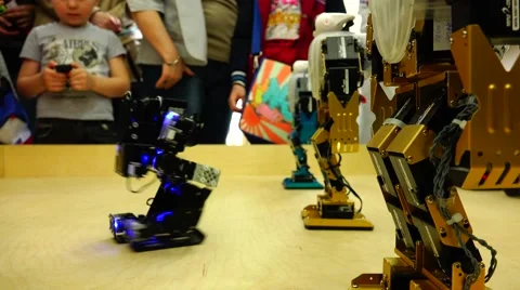 New technologies. Robot. AI. Children playing with robots. Stock Footage 50299009